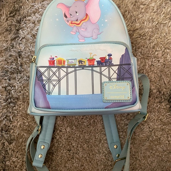 blue white pin strip mini backpack Backer This fabric has been specifically developed by TRVL as an environmentally friendly alternative for TRVL Families! Wipeable Small Backpack by Mint